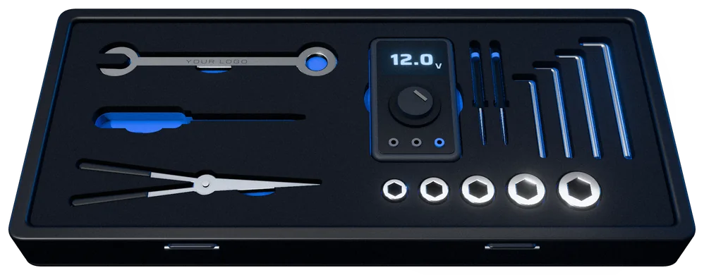 An open toolkit case with each tool fitted into black shadow foam over an electric-blue layer. The screwdriver's pocket is empty, so its blue outline shows.